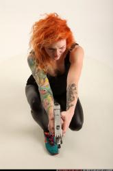 zora-kneeling-aiming-uzi