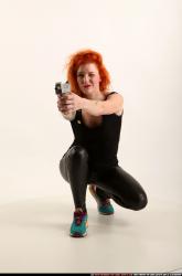 zora-kneeling-aiming-uzi