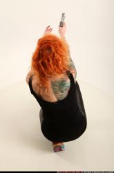 zora-kneeling-aiming-uzi