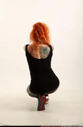 zora-kneeling-aiming-uzi