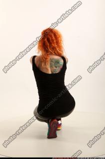 2016 05 ZORA KNEELING AIMING UZI 04 B