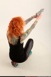 zora-kneeling-aiming-uzi