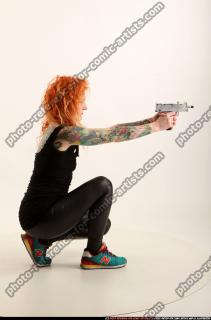 2016 05 ZORA KNEELING AIMING UZI 06 B