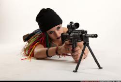 Woman Young Average White Fighting with submachine gun Laying poses Casual