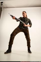 Woman Young Athletic White Standing poses Army Fighting with shotgun