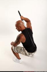 Man Adult Athletic Black Fighting with sword Kneeling poses Army