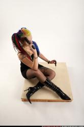 dolores-sitting-pistol-knife-pose