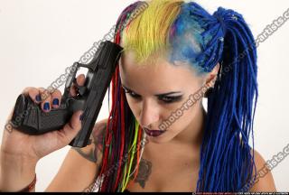 dolores-sitting-pistol-knife-pose