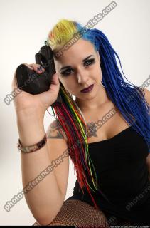dolores-sitting-pistol-knife-pose