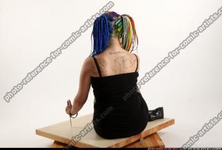 2016 07 DOLORES SITTING PISTOL KNIFE POSE 03 B