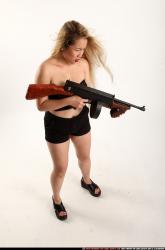 Woman Young Average Fighting with submachine gun Standing poses Casual Asian