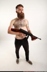 oscar-standing-tommygun-guarding