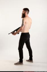 oscar-standing-tommygun-guarding