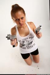 agnes-kneeling-uzi-pistol