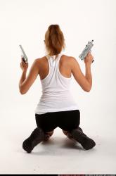 agnes-kneeling-uzi-pistol