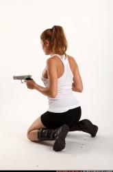 agnes-kneeling-uzi-pistol