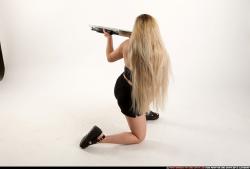 Woman Young Average Kneeling poses Casual Asian Fighting with shotgun