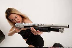 Woman Young Average Kneeling poses Casual Asian Fighting with shotgun