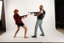 Man & Woman Adult Athletic White Fighting with submachine gun Standing poses Casual