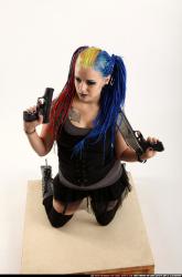 dolores-kneeling-pistol-shotgun