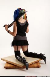 dolores-kneeling-pistol-shotgun