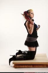 dolores-kneeling-pistol-shotgun