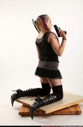 dolores-kneeling-pistol-shotgun