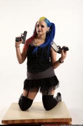 dolores-kneeling-pistol-shotgun