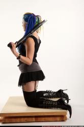 dolores-kneeling-pistol-shotgun