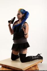 dolores-kneeling-pistol-shotgun