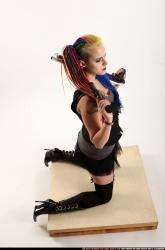 dolores-kneeling-pistol-shotgun