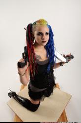 dolores-kneeling-pistol-shotgun