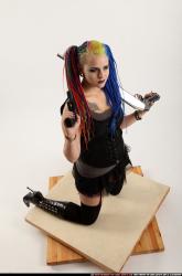 dolores-kneeling-pistol-shotgun