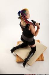 dolores-kneeling-pistol-shotgun