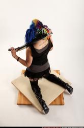 dolores-kneeling-pistol-shotgun