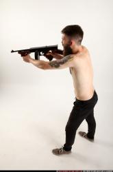 oscar-standing-tommygun-shooting