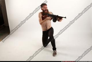 2016 10 OSCAR KNEELING TOMMYGUN SHOOTING 07 A