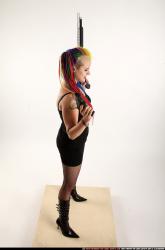 dolores-standing-pistol-shotgun