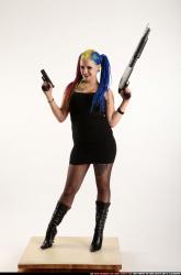 dolores-standing-pistol-shotgun