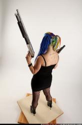dolores-standing-pistol-shotgun