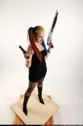 dolores-standing-pistol-shotgun