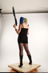 dolores-standing-pistol-shotgun