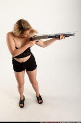 Woman Young Average Standing poses Casual Asian Fighting with shotgun