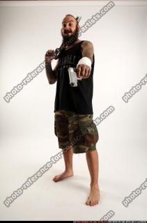 2016 12 EDGAR STANDING AIMING SHOTGUN PISTOL 00 C