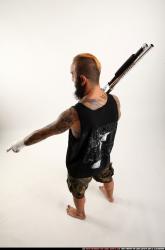 edgar-standing-aiming-shotgun-pistol