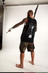 edgar-standing-aiming-shotgun-pistol