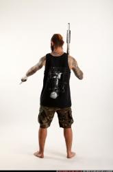 edgar-standing-aiming-shotgun-pistol