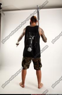 2016 12 EDGAR STANDING AIMING SHOTGUN PISTOL 03 C