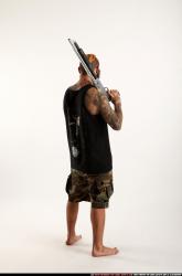 edgar-standing-aiming-shotgun-pistol