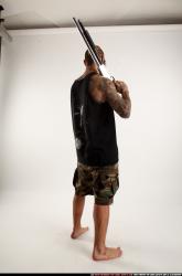 edgar-standing-aiming-shotgun-pistol